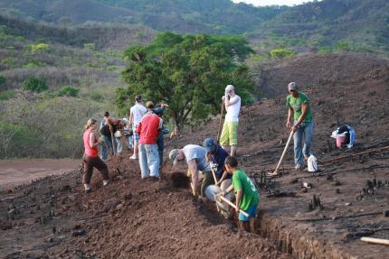 A group of people digging a trench in Honduras 
