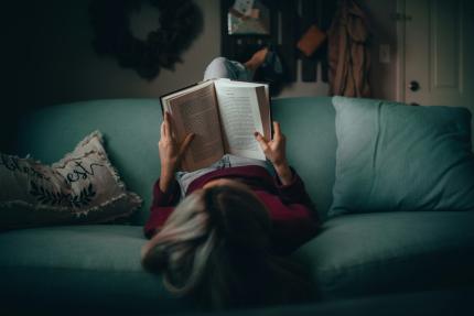 Overhead view of someone reading a book