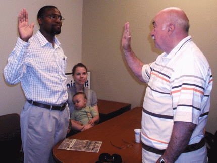 Cornelius Muasa was sworn in to the chaplaincy by Rev. Herm Keizer, Jr.