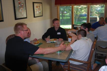 Members of the Georgetown classis have dinner with residents of Harbor House.