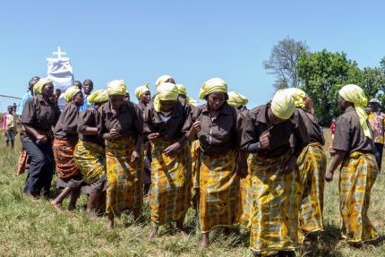 A royal procession escorts a copy of the newly-printed New Testament to the celebration, showing how God's Word is esteemed by the Oku community of Cameroon.