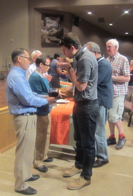 Communion takes place to finish Prayer Summit 2015.