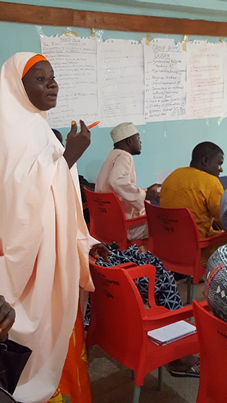 Woman helps lead conference.