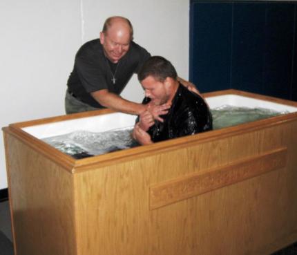 Pastor Rick Admiraal baptizes Mike at the Newton Correctional Facility.