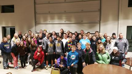 The DeJongs with their youth group in Pella, Iowa