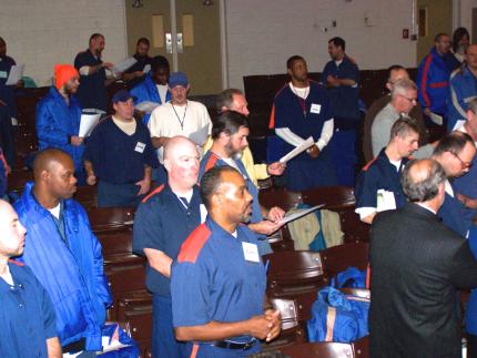 Inmates and volunteers worship at Handlon Correctional Facility.