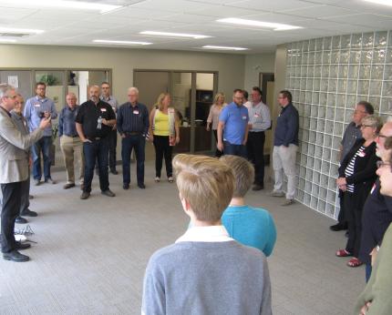  Darren Roorda, far left, talks about renovations to the Burlington, Ont. office of the CRCNA. 
