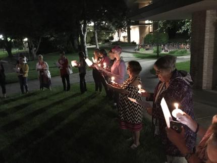 Women shared a liturgy by candlelight.