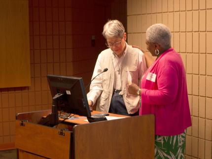 Joan Flikkema (left) receives a special thank you from Denise Posie
