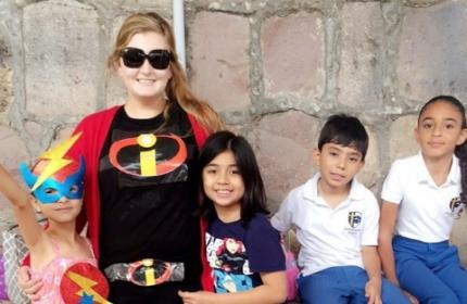 Hannah Damsteegt with young students