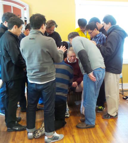 Korean pastors pray for James DeJong