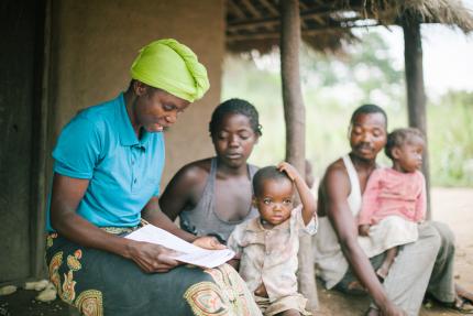A World Renew health volunteer connecting with families in Mozambique. 