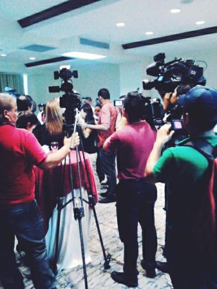 Journalists gather for press conference about intimidation.