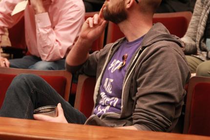 A spectator listens as Synod 2019 discusses an interim report on human sexuality.