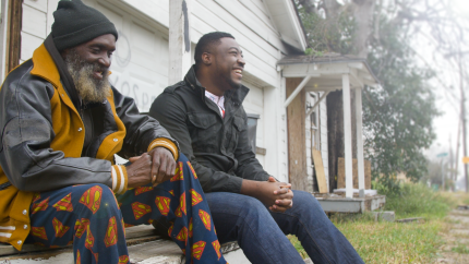 John Eigege works with residents of Houston's third ward which so far has escaped much of the flooding.