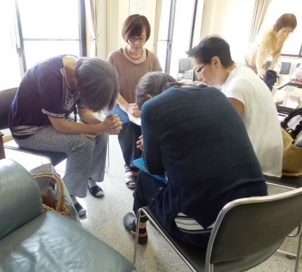 Mrs. Ohashi (center, brown shirt) knows the value in having fellowship with fellow believers.