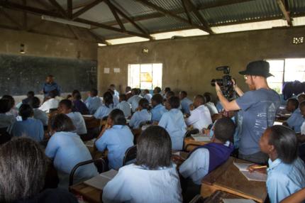 Mike films students studying in a classroom in Kenya.