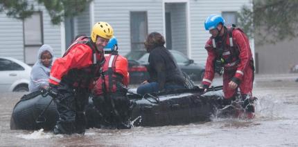 North Carolina emergency services evacuate residents of a neighborhood that fell victim to the flooding caused by Hurricane Matthew in Fayetteville, N.C.