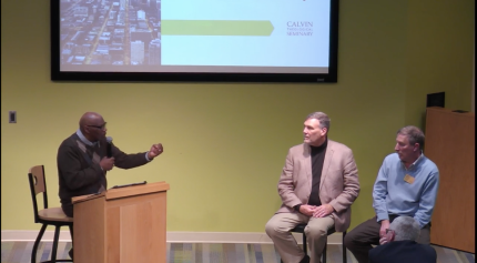 Emmett Harrison, left, speaks to John Algera and David Beelen.
