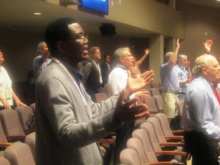 People pray during the CRC’s Prayer Summit 2015