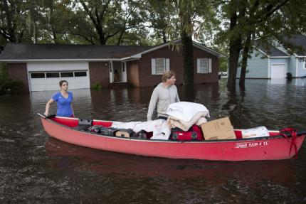 A couple braves the flooding in South Carolina.