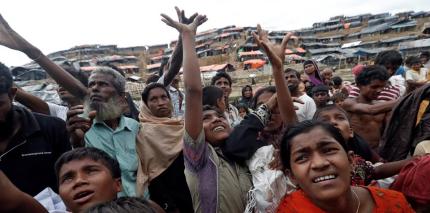 Aid is distributed to Rohingya refugees after their arrival at Coxs Bazar, Bangladesh Sept. 18, 2017. 