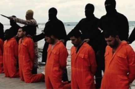 Coptic Christians kneel before they were killed by ISIS.