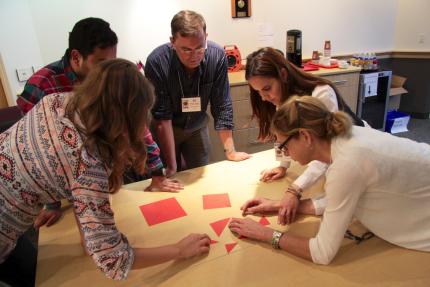 Participants take part in a team activity at Serving 360.