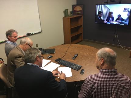 Representatives of three ministries sign document agreeing to new ministry partnership using media to reach out to the Arab world.