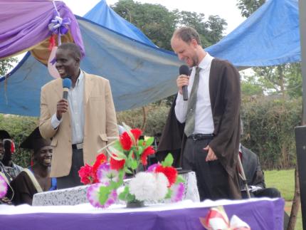 Anthony Sytsma (right) shares a laugh during the graduation ceremony.
