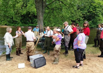 Members of Trinity CRC gather to monitor stream.
